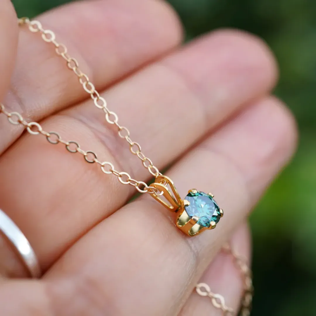 /public/photos/live/Delicate Round Cut Dark Green Moissanite Pendant   767 (5).webp